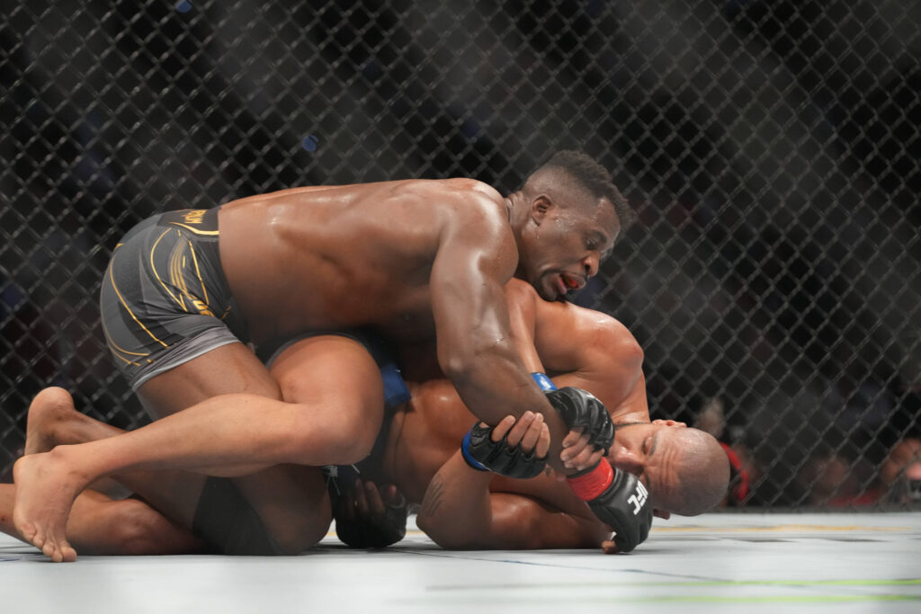 January 22, 2022, Anaheim, California, Anaheim, CA, United States: ANAHEIM, CA - JANUARY 22: Francis Ngannou (top) controls the body of Ciryl Gane in their Heavyweight championship fight during the UFC 270 event at Honda Center on January 22, 2022 in Anaheim, California, United States. Anaheim, California United States - ZUMAp175 20220122_zsa_p175_172 